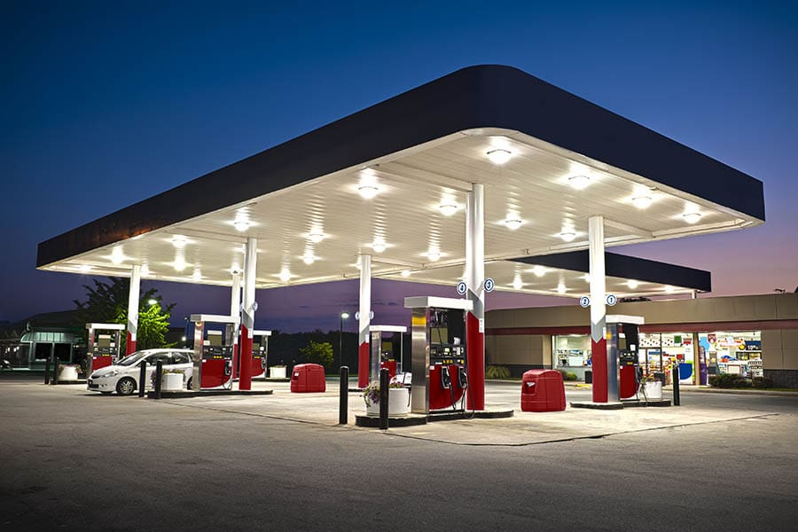Gas Station Insurance - Night View of a Gas Station with Cars Pumping Gas
